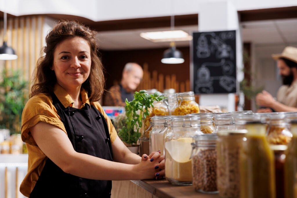 portrait happy zero waste shop vendor -
